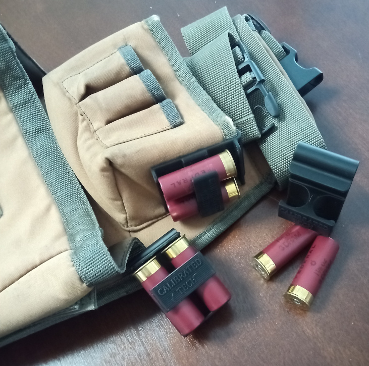 12 gauge Dual Spare Shell Holder clipped onto a shooting pouch
